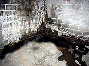 Block basement requiring a subfloor drainage system